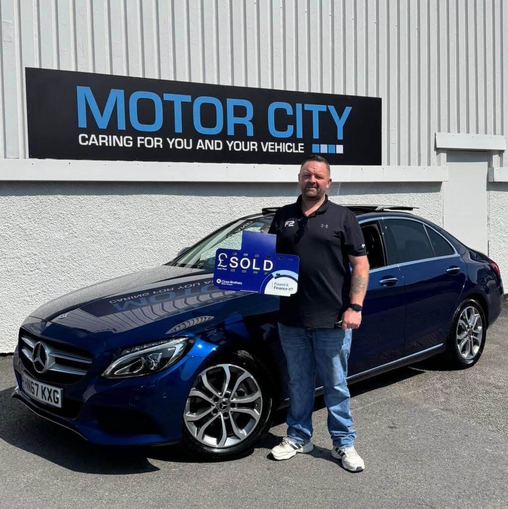 Another happy Motor City Plymouth customer